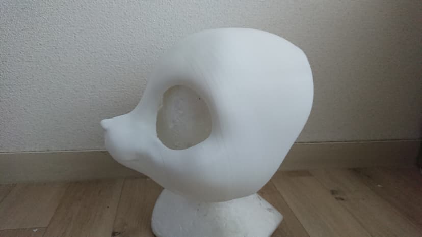 A plastic feline headbase